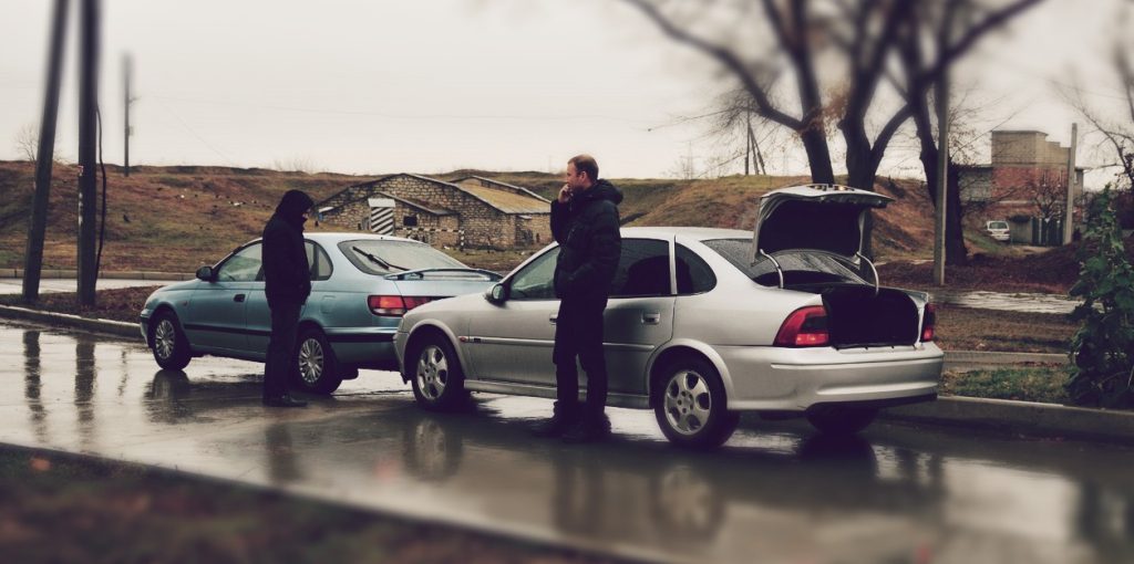 Two men in a rear-end collision