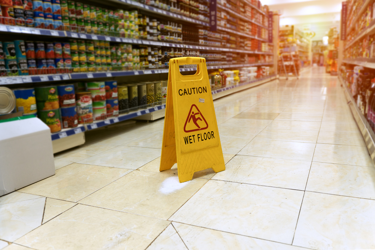 Grocery store slip and fall accident sign.