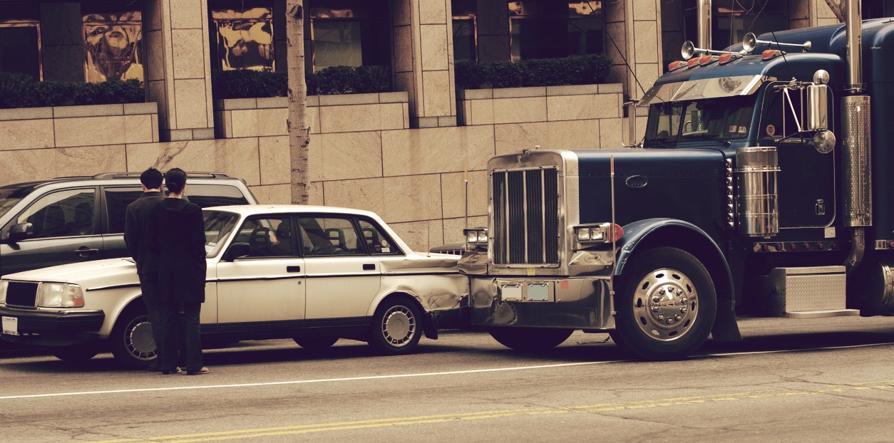 Semi-truck hitting a white car