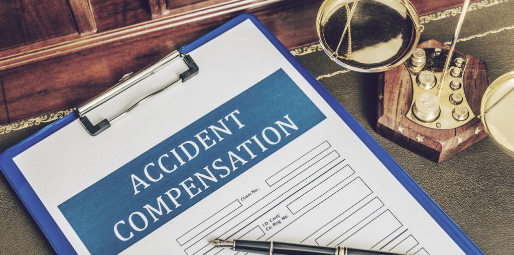 Accident compensation form on clipboard